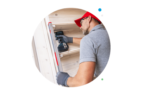 employee installing and building shelving units