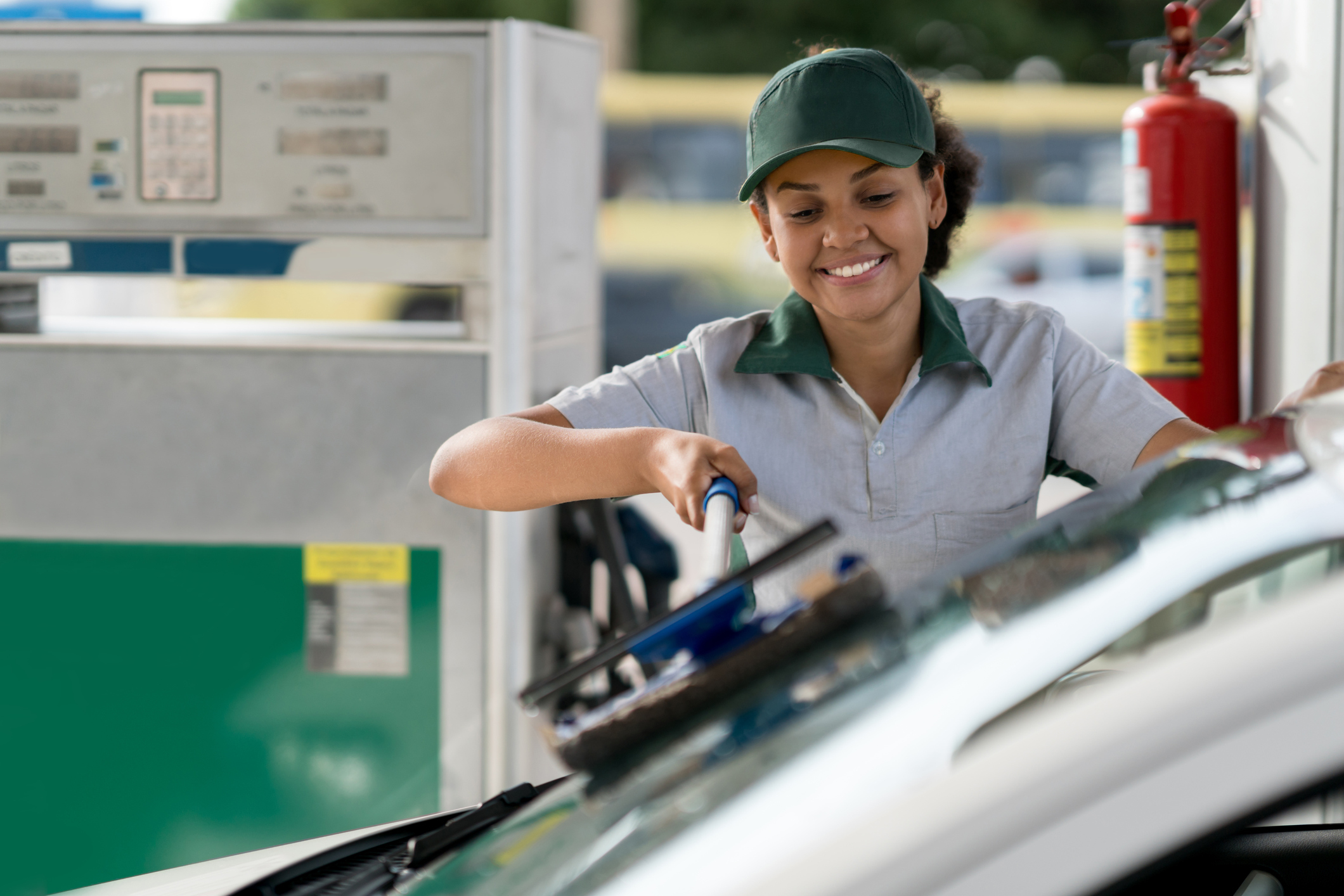 Employee helping a customer at a convenience and gas store